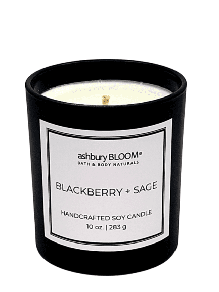 Blackberry Sage Soy Wax Candle - A beautifully crafted soy wax candle by ashbury BLOOM in a glass jar, emitting a warm and inviting glow. The candle is made from natural soy wax, offering a clean and long-lasting burn. It features a delicate fragrance of plump blackberries and earthy aroma of crushed sage, perfect for creating a cozy atmosphere in any room.