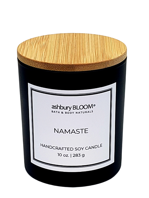 Namaste Soy Wax Candle - A beautifully crafted soy wax candle by ashbury BLOOM in a glass jar, emitting a warm and inviting glow. The candle is made from natural soy wax, offering a clean and long-lasting burn. It features a delicate fragrance of intoxicating fragrance, which combines the fresh scent of pomegranate with the delicate notes of red poppies and amber, perfect for creating a cozy atmosphere in any room