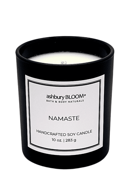Namaste Soy Wax Candle - A beautifully crafted soy wax candle by ashbury BLOOM in a glass jar, emitting a warm and inviting glow. The candle is made from natural soy wax, offering a clean and long-lasting burn. It features a delicate fragrance of intoxicating fragrance, which combines the fresh scent of pomegranate with the delicate notes of red poppies and amber, perfect for creating a cozy atmosphere in any room