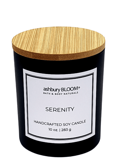 Serenity Soy Wax Candle - A beautifully crafted soy wax candle by ashbury BLOOM in a glass jar, emitting a warm and inviting glow. The candle is made from natural soy wax, offering a clean and long-lasting burn. It features a delicate fragrance of top notes of orange and bergamot, a warm heart of cinnamon and clove, and lingering aromas of patchouli, perfect for creating a cozy atmosphere in any room.