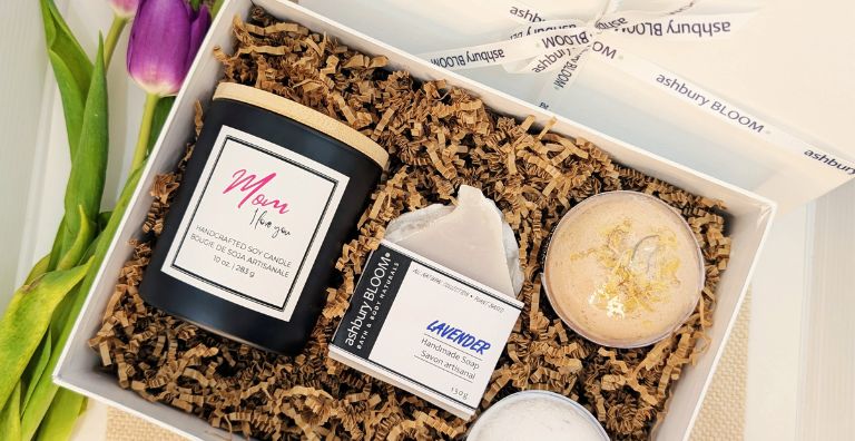 Mother’s Day gift box with Ashbury Bloom candle, bath bombs, lavender soap, and tulips on the side