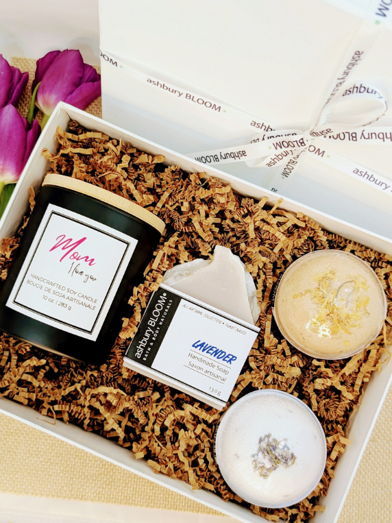 Mother’s Day bath and body gift box with soy wax candle, handmade soap, bath bombs, and Ashbury Bloom ribbon