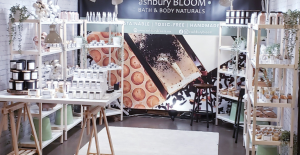 Boutique display of Ashbury Bloom products on shelving, showcasing curated wholesale items and bath & body collections.