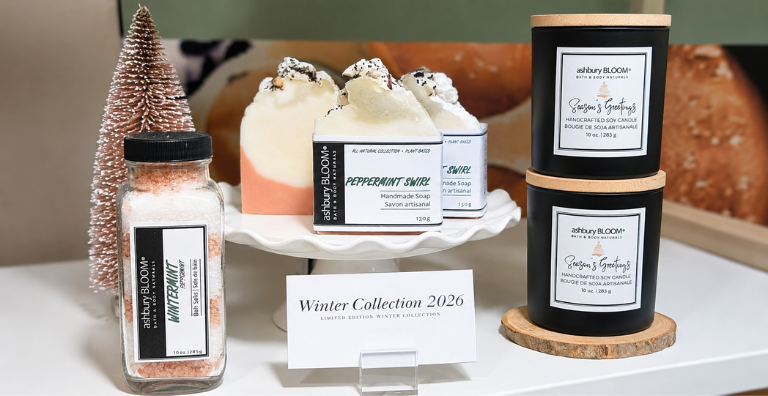 Ashbury Bloom Winter Collection 2026 display featuring Peppermint Swirl handmade soaps, Wintermint bath salts, Season’s Greetings soy candles, and festive holiday décor.